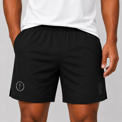 Black 7-in shorts with elastic waistband and side logo patch