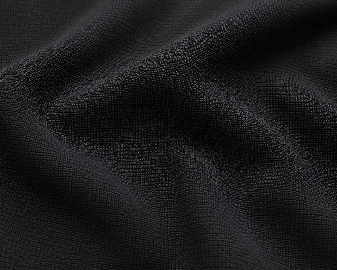 Black knit fabric texture close-up